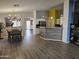 Spacious living space featuring wood flooring, modern lighting, and open floor plan at 11760 N 153Rd Ave, Surprise, AZ 85379