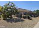 Single story home with desert landscaping and neutral exterior paint with tile roof at 11760 N 153Rd Ave, Surprise, AZ 85379