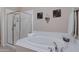 Bright bathroom boasts a soaking tub, glass shower, and decorative wall art at 12946 N Northstar Dr, Fountain Hills, AZ 85268
