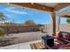Inviting covered patio with stylish outdoor seating and a modern fire pit, perfect for relaxation at 12946 N Northstar Dr, Fountain Hills, AZ 85268