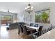 Open dining room with views into living room, featuring six-chair table set and decorative chandelier at 12946 N Northstar Dr, Fountain Hills, AZ 85268