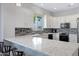 Modern kitchen with white cabinetry, stainless steel appliances, and a stylish backsplash at 12946 N Northstar Dr, Fountain Hills, AZ 85268