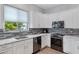 Contemporary kitchen with white cabinets, stainless steel appliances, and granite countertops at 12946 N Northstar Dr, Fountain Hills, AZ 85268