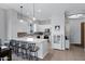 Bright kitchen with white cabinets, granite countertops, and seating at the large center island at 12946 N Northstar Dr, Fountain Hills, AZ 85268