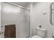 Bathroom featuring a sliding glass shower door and efficient commode at 14123 W Yosemite Dr, Sun City West, AZ 85375