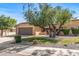 Traditional single-Gathering home with a two-car garage and mature landscaping at 14123 W Yosemite Dr, Sun City West, AZ 85375