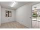 Flex room with tile flooring and access to the backyard and patio area at 14123 W Yosemite Dr, Sun City West, AZ 85375