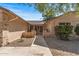 Charming front entrance with lush landscaping and a welcoming walkway at 14123 W Yosemite Dr, Sun City West, AZ 85375