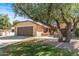 Charming single-story home featuring a two-car garage and mature trees in a well-kept neighborhood at 14123 W Yosemite Dr, Sun City West, AZ 85375