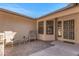 Inviting front porch with stylish seating and a secure screen door, creating a welcoming entrance at 14123 W Yosemite Dr, Sun City West, AZ 85375