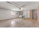 Large garage with washer, dryer, and storage with natural lighting at 14123 W Yosemite Dr, Sun City West, AZ 85375