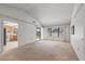Bright, airy living room leading to the backyard, featuring clean carpet and ample natural light at 14123 W Yosemite Dr, Sun City West, AZ 85375