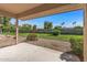 Covered patio provides backyard views and a peaceful place to relax at 14123 W Yosemite Dr, Sun City West, AZ 85375