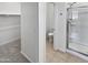 Bright bathroom with shower, toilet, and walk-in closet at 14154 W Voltaire St, Surprise, AZ 85379