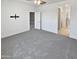 Neutral bedroom featuring soft gray carpet with doorways to the bathroom and closet at 14154 W Voltaire St, Surprise, AZ 85379