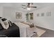 Well-lit bedroom boasts contemporary decor, woven shades, ceiling fan and comfortable carpeting at 1431 E San Juan Ave, Phoenix, AZ 85014