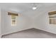 Cozy bedroom with neutral walls, a ceiling fan, and woven shades at 1431 E San Juan Ave, Phoenix, AZ 85014
