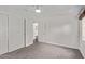 Bright bedroom with walk-in closet, ceiling fan, neutral walls, and carpet at 1431 E San Juan Ave, Phoenix, AZ 85014