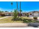 Inviting single-story home with a lush green lawn, mature landscaping, and a welcoming walkway to the front door at 1431 E San Juan Ave, Phoenix, AZ 85014