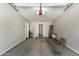 Spacious garage with an automatic door, offering parking and storage with a separate doorway to the home at 1431 E San Juan Ave, Phoenix, AZ 85014