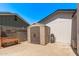 Backyard showing a plastic storage shed with an outdoor hose and adjacent raised garden bed at 1431 E San Juan Ave, Phoenix, AZ 85014