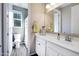 Clean bathroom with white cabinets and natural light at 14770 W Voltaire St, Surprise, AZ 85379