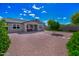 Exterior view of a well-maintained single-story home with desert landscaping and a charming covered porch at 14770 W Voltaire St, Surprise, AZ 85379
