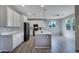 Modern kitchen featuring white cabinets, stainless steel appliances, and a center island at 14770 W Voltaire St, Surprise, AZ 85379