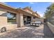 Exterior shot of the home featuring a spacious patio with outdoor seating and stunning golf course views at 15240 N Clubgate Dr # 137, Scottsdale, AZ 85254