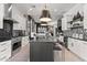 Spacious open concept kitchen featuring a large center island, modern appliances and adjacent living room with lots of light at 15240 N Clubgate Dr # 137, Scottsdale, AZ 85254