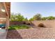 Relaxing backyard features turf and rock landscaping, and privacy wall at 15432 W Yucatan Dr, Surprise, AZ 85379