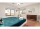 This bedroom has a king-size bed, a window, a chest of drawers, and a comfy rug at 15432 W Yucatan Dr, Surprise, AZ 85379