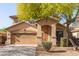 Charming two-story home featuring an attached two-car garage and a welcoming front porch at 15432 W Yucatan Dr, Surprise, AZ 85379