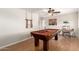 Spacious game room boasts a billiard table, ceiling fan, and a view of the doorway at 15432 W Yucatan Dr, Surprise, AZ 85379