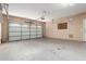 Spacious two car garage with ample room for parking and storage space at 15432 W Yucatan Dr, Surprise, AZ 85379