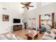 Bright living room with hardwood floors, high ceilings, and comfortable seating arrangements at 15432 W Yucatan Dr, Surprise, AZ 85379