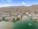 Aerial view showcases expansive community lakeside homes, parks, and greenery at 16013 S Desert Foothills Pkwy # 2130, Phoenix, AZ 85048