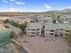 Aerial view of lakeside condo community, showcasing waterfront access and design at 16013 S Desert Foothills Pkwy # 2130, Phoenix, AZ 85048