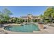 Gorgeous community pool and hot tub with landscaped grounds and lounge seating at 16013 S Desert Foothills Pkwy # 2130, Phoenix, AZ 85048