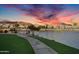 Scenic community path along the waterfront with sunset views at 16013 S Desert Foothills Pkwy # 2130, Phoenix, AZ 85048