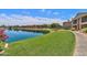 Beautiful lakefront property with lush green lawns and serene walking path for an outdoor and relaxing atmosphere at 16013 S Desert Foothills Pkwy # 2130, Phoenix, AZ 85048