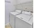 Laundry room with a stacked washer and dryer unit and wire shelving at 16013 S Desert Foothills Pkwy # 2130, Phoenix, AZ 85048