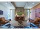 Relaxing lounge area with soft lighting, comfortable seating, and a large flatscreen television at 16013 S Desert Foothills Pkwy # 2130, Phoenix, AZ 85048
