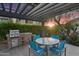 Outdoor patio features a built-in BBQ, dining table, and shade structure at 16013 S Desert Foothills Pkwy # 2130, Phoenix, AZ 85048