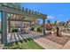 Charming covered outdoor patio with dining area and grill, perfect for gatherings and cookouts at 16013 S Desert Foothills Pkwy # 2130, Phoenix, AZ 85048