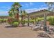 Inviting outdoor patio with lounge chairs and shaded pergola, perfect for relaxing and entertaining at 16013 S Desert Foothills Pkwy # 2130, Phoenix, AZ 85048