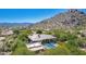 Scenic aerial view of the property showcasing the backyard pool and the desert mountain backdrop at 16469 N 113Th Way, Scottsdale, AZ 85255