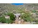 Picturesque aerial view of the home with meticulous landscaping nestled against the desert mountain at 16469 N 113Th Way, Scottsdale, AZ 85255