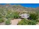 Aerial view of the property with a circular driveway, gated entry and mature landscaping at 16469 N 113Th Way, Scottsdale, AZ 85255