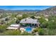 Beautiful aerial view of the expansive property with mature landscaping, pool and mountain views at 16469 N 113Th Way, Scottsdale, AZ 85255